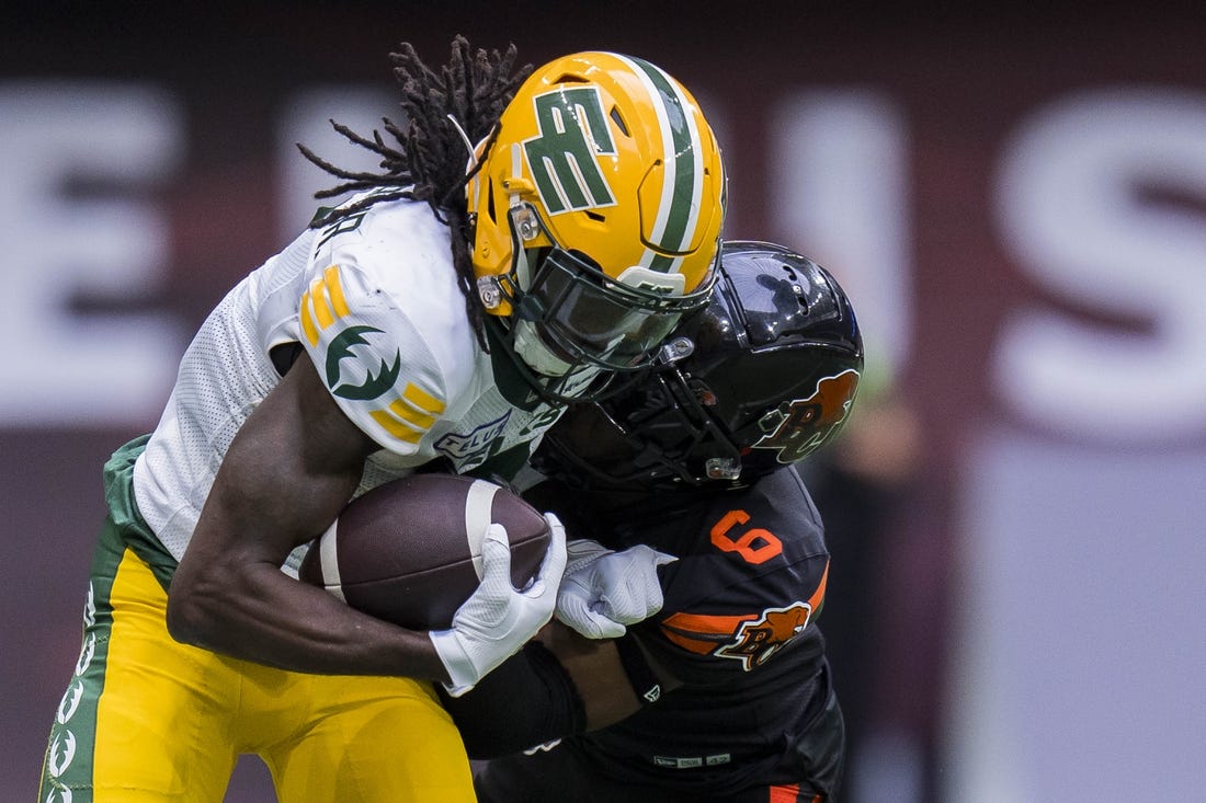 Jun 17, 2023; Vancouver, British Columbia, CAN; BC Lions defensive back TJ Lee (6) tackles Edmonton Elks receiver Steven Dunbar Jr. (7) in the second half at BC Place. BC won 22-0. Mandatory Credit: Bob Frid-USA TODAY Sports