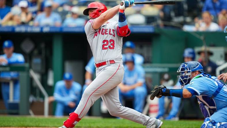 Jun 18, 2023; Kansas City, Missouri, USA; Los Angeles Angels first baseman Brandon Drury (23) hits an RBI single during the second inning against the Kansas City Royals at Kauffman Stadium. Mandatory Credit: Jay Biggerstaff-USA TODAY Sports