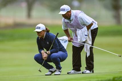 Jun 22, 2023; Springfield, New Jersey, USA; Marissa Steen and her caddie line up a putt on the 1st green during the first round of the KPMG Women's PGA Championship golf tournament. Mandatory Credit: John Jones-USA TODAY Sports