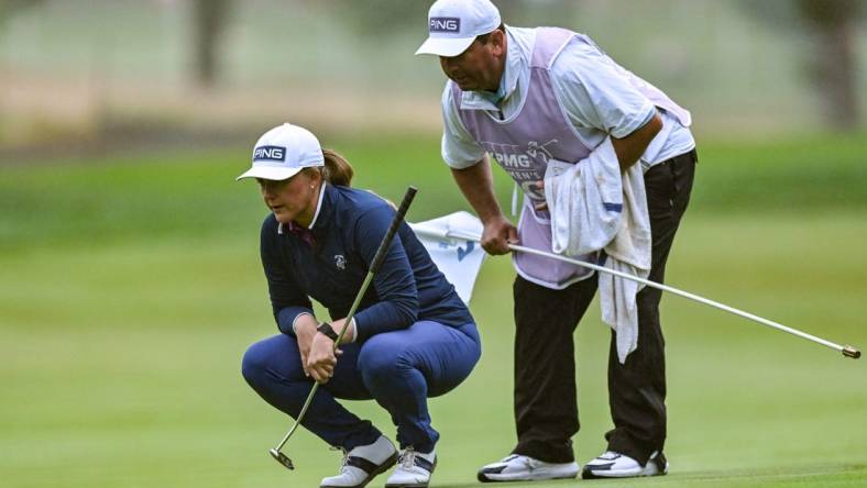 Jun 22, 2023; Springfield, New Jersey, USA; Marissa Steen and her caddie line up a putt on the 1st green during the first round of the KPMG Women's PGA Championship golf tournament. Mandatory Credit: John Jones-USA TODAY Sports