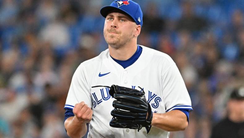 Jun 23, 2023; Toronto, Ontario, CAN;  Toronto Blue Jays relief pitcher Erik Swanson (50) reacts after the final out of the eighth inning against the Oakland Athletics at Rogers Centre. Mandatory Credit: Dan Hamilton-USA TODAY Sports