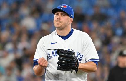 Jun 23, 2023; Toronto, Ontario, CAN;  Toronto Blue Jays relief pitcher Erik Swanson (50) reacts after the final out of the eighth inning against the Oakland Athletics at Rogers Centre. Mandatory Credit: Dan Hamilton-USA TODAY Sports