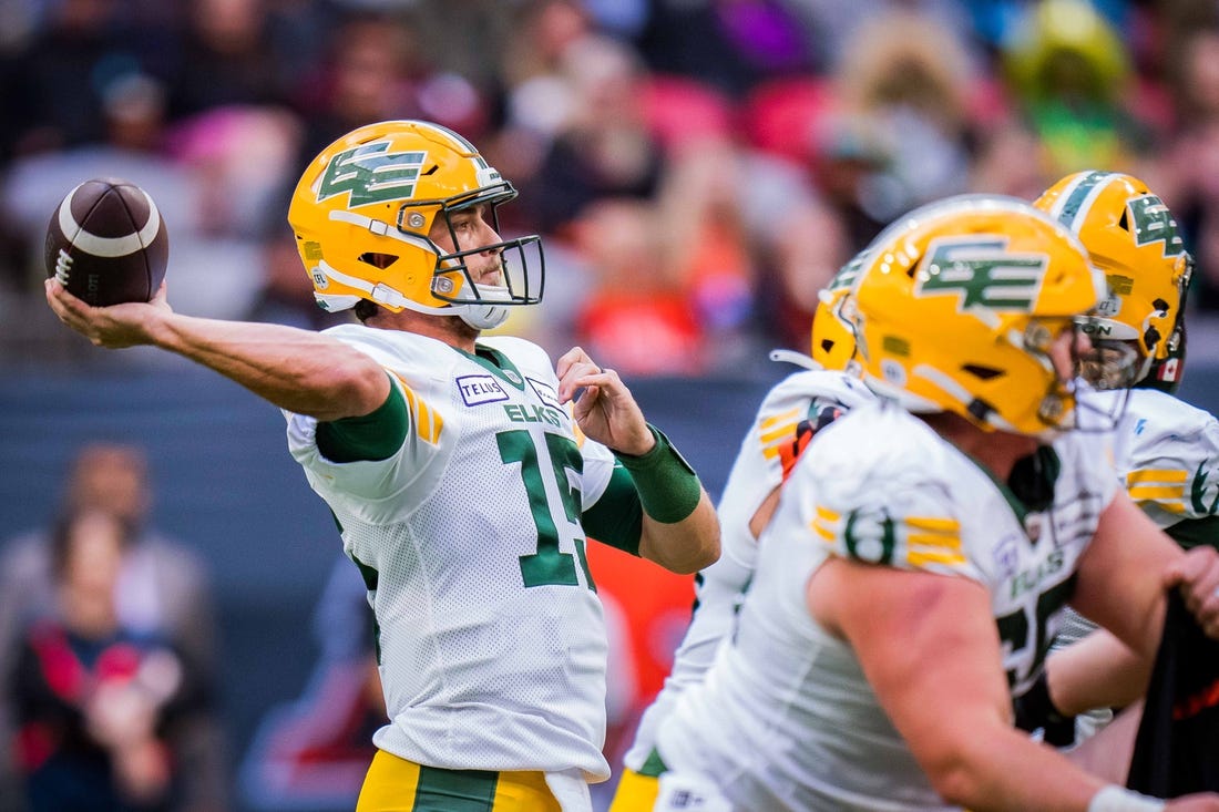 Jun 17, 2023; Vancouver, British Columbia, CAN; Edmonton Elks quarterback Taylor Cornelius (15) makes a pass against the BC Lions in the first half at BC Place. Mandatory Credit: Bob Frid-USA TODAY Sports