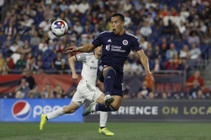 Jun 24, 2023; Foxborough, Massachusetts, USA; New England Revolution forward Bobby Wood (17) goes up to control the ball against the Toronto FC during the second half at Gillette Stadium. Mandatory Credit: Winslow Townson-USA TODAY Sports