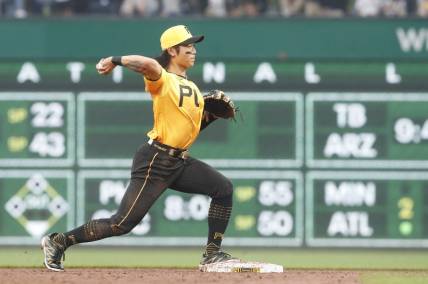 Jun 27, 2023; Pittsburgh, Pennsylvania, USA;  Pittsburgh Pirates center fielder Ji Hwan Bae (3) throws to first base to complete a double play against the San Diego Padres during the third inning at PNC Park. Mandatory Credit: Charles LeClaire-USA TODAY Sports