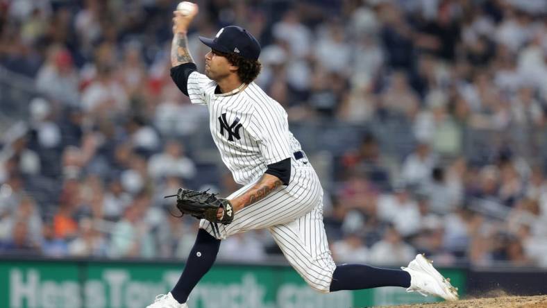 Jul 6, 2023; Bronx, New York, USA; New York Yankees relief pitcher Deivi Garcia (83) pitches against the Baltimore Orioles during the fourth inning at Yankee Stadium. Mandatory Credit: Brad Penner-USA TODAY Sports