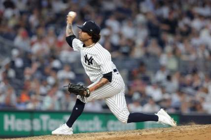 Jul 6, 2023; Bronx, New York, USA; New York Yankees relief pitcher Deivi Garcia (83) pitches against the Baltimore Orioles during the fourth inning at Yankee Stadium. Mandatory Credit: Brad Penner-USA TODAY Sports