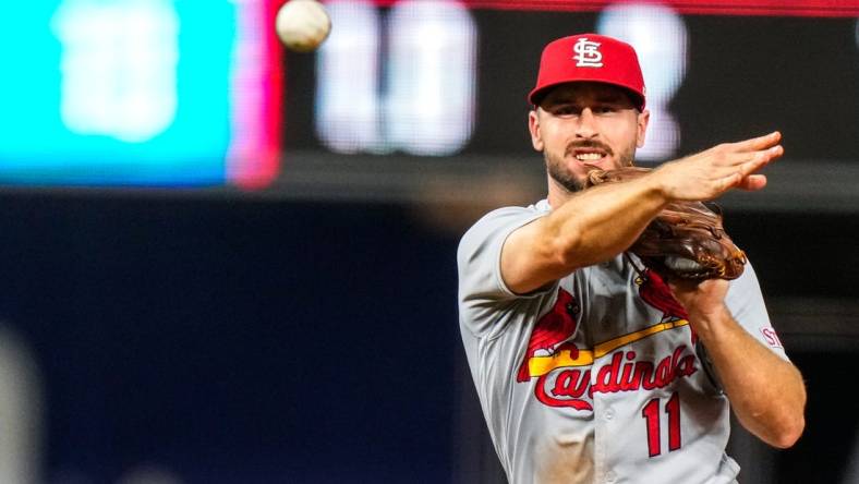 Jul 6, 2023; Miami, Florida, USA; St. Louis Cardinals shortstop Paul DeJong (11) throws the ball to first base against the Miami Marlins during the eighth inning at loanDepot Park. Mandatory Credit: Rich Storry-USA TODAY Sports