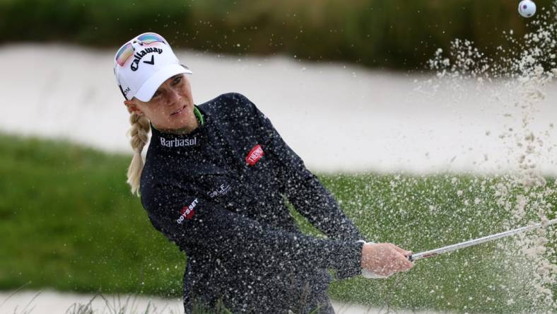 Jul 7, 2023; Pebble Beach, California, USA; Madelene Sagstrom hits out of a bunker on the seventeenth hole during the second round of the U.S. Women's Open golf tournament at Pebble Beach Golf Link. Mandatory Credit: Kiyoshi Mio-USA TODAY Sports