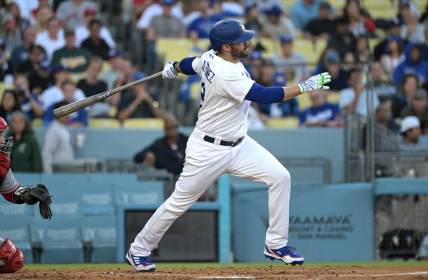 Jul 7, 2023; Los Angeles, California, USA; Los Angeles Dodgers designated hitter J.D. Martinez (28) hits a solo home run in the second inning against the Los Angeles Angels at Dodger Stadium. Mandatory Credit: Jayne Kamin-Oncea-USA TODAY Sports
