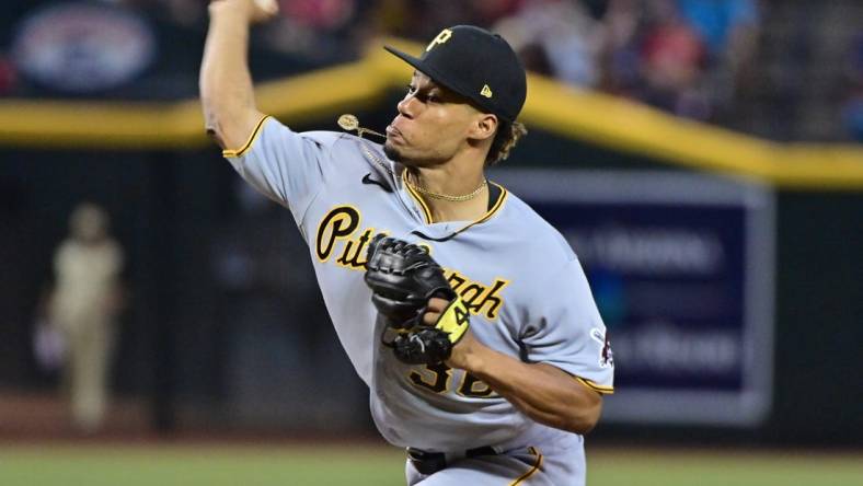 Jul 7, 2023; Phoenix, Arizona, USA; Pittsburgh Pirates relief pitcher Dauri Moreta (36) throws in the eighth inning against the Arizona Diamondbacks  at Chase Field. Mandatory Credit: Matt Kartozian-USA TODAY Sports