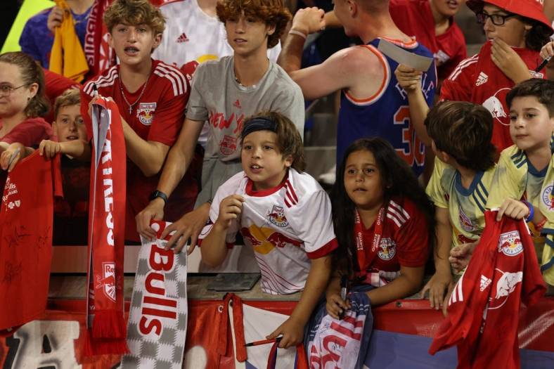 Jul 8, 2023; Harrison, New Jersey, USA; New York Red Bulls fans cheering and asking for autographs after the game at Red Bull Arena. Mandatory Credit: Vincent Carchietta-USA TODAY Sports