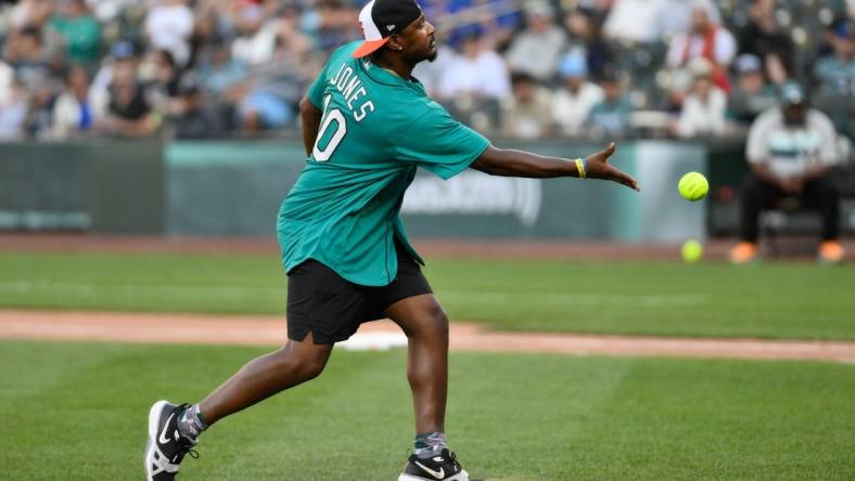 Jul 8, 2023; Seattle, Washington, USA; Former MLB All-Star Adam Jones pitches during the All-Star Celebrity Game at T-Mobile Park. Mandatory Credit: Steven Bisig-USA TODAY Sports