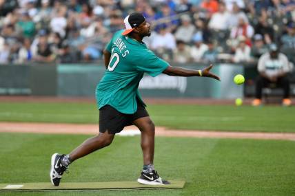 Jul 8, 2023; Seattle, Washington, USA; Former MLB All-Star Adam Jones pitches during the All-Star Celebrity Game at T-Mobile Park. Mandatory Credit: Steven Bisig-USA TODAY Sports