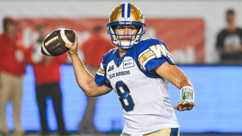 Jul 1, 2023; Montreal, Quebec, CAN; Winnipeg Blue Bombers quarterback Zach Collaros (8) passes the ball against the Montreal Alouettes during the first quarter at Percival Molson Memorial Stadium. Mandatory Credit: David Kirouac-USA TODAY Sports