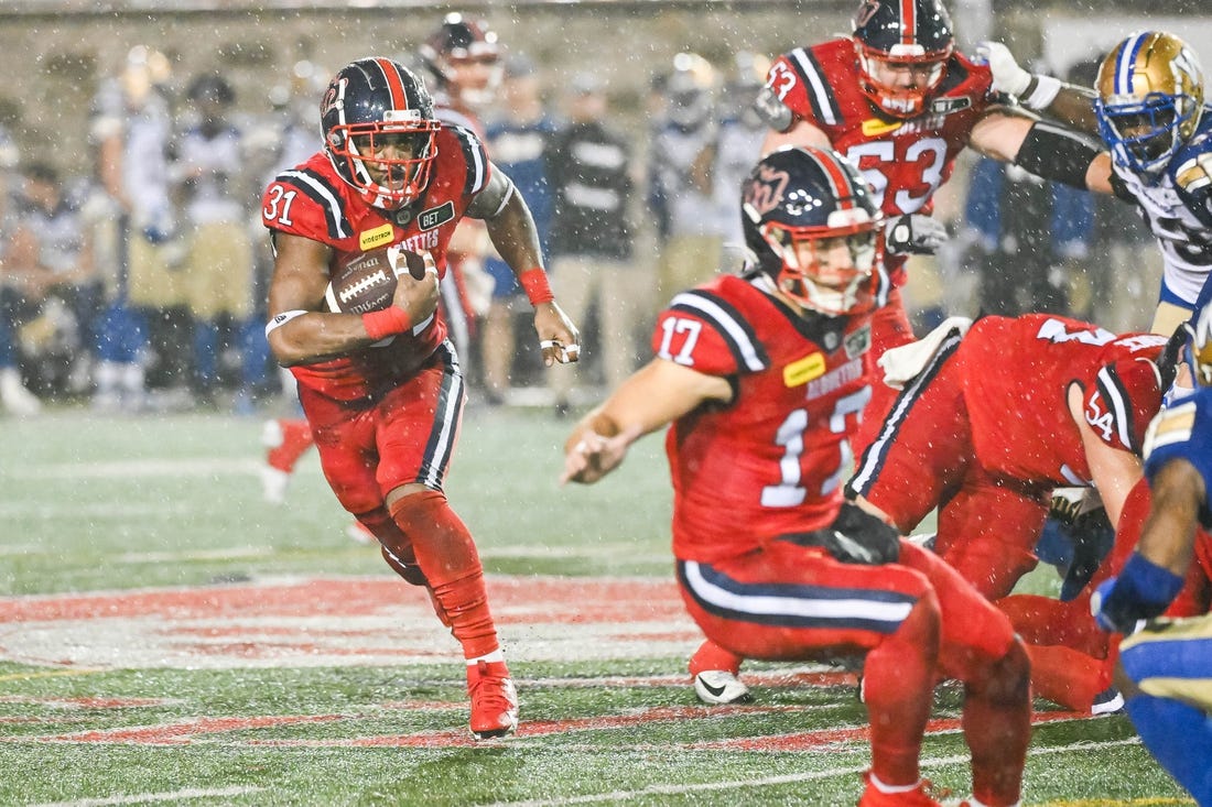 Jul 1, 2023; Montreal, Quebec, CAN; Montreal Alouettes running back William Stanback (31) runs the ball against the Winnipeg Blue Bombers during the fourth quarter at Percival Molson Memorial Stadium. Mandatory Credit: David Kirouac-USA TODAY Sports