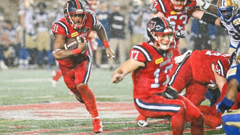 Jul 1, 2023; Montreal, Quebec, CAN; Montreal Alouettes running back William Stanback (31) runs the ball against the Winnipeg Blue Bombers during the fourth quarter at Percival Molson Memorial Stadium. Mandatory Credit: David Kirouac-USA TODAY Sports