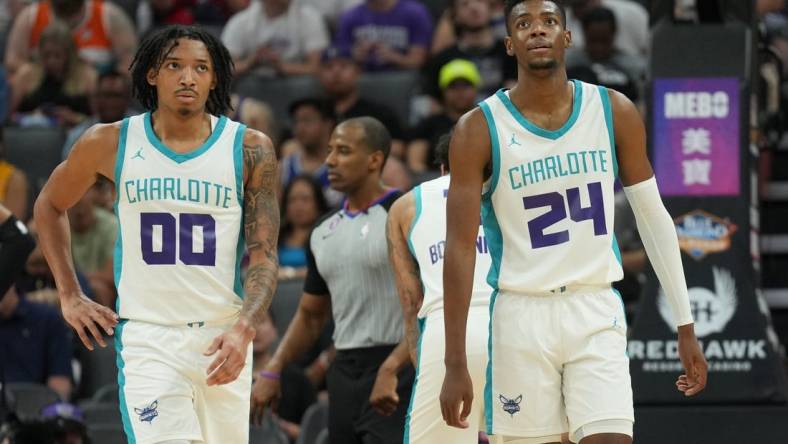 Jul 3, 2023; Sacramento, CA, USA; Charlotte Hornets guard Nick Smith Jr. (00) and forward Brandon Miller (24) walk on the court during the third quarter at Golden 1 Center. Mandatory Credit: Darren Yamashita-USA TODAY Sports