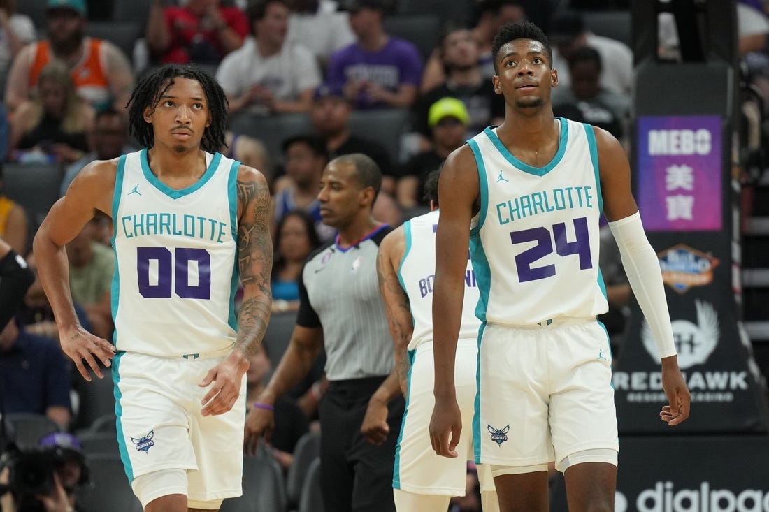 Jul 3, 2023; Sacramento, CA, USA; Charlotte Hornets guard Nick Smith Jr. (00) and forward Brandon Miller (24) walk on the court during the third quarter at Golden 1 Center. Mandatory Credit: Darren Yamashita-USA TODAY Sports