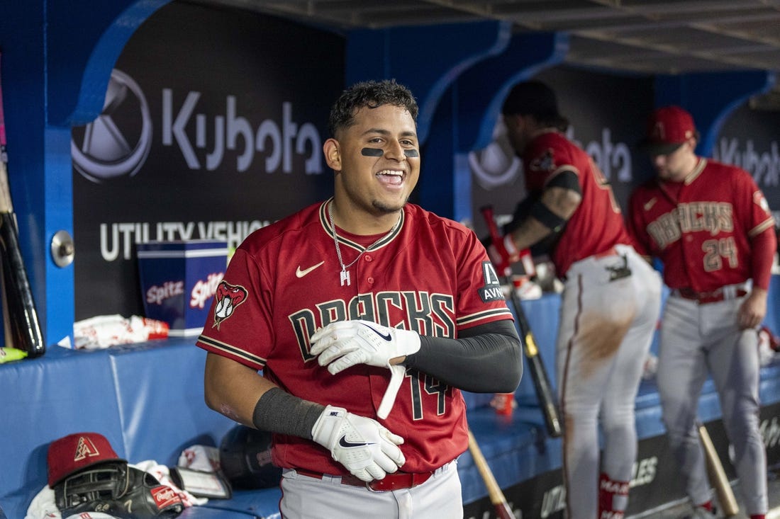 Jul 14, 2023; Toronto, Ontario, CAN; Arizona Diamondbacks catcher Gabriel Moreno (14) celebrates after hitting a home run against the Toronto Blue Jays during the seventh inning at Rogers Centre. Mandatory Credit: Kevin Sousa-USA TODAY Sports