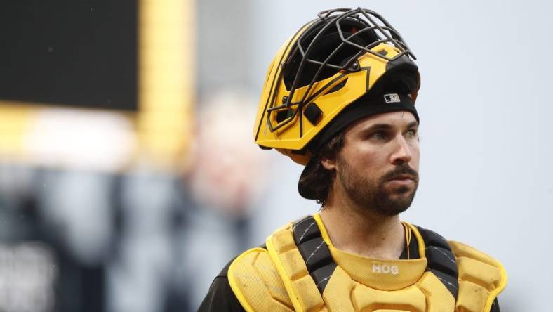 Jul 15, 2023; Pittsburgh, Pennsylvania, USA;  Pittsburgh Pirates catcher Austin Hedges (18) makes his way in from the bullpen to play the San Francisco Giants at PNC Park. Mandatory Credit: Charles LeClaire-USA TODAY Sports