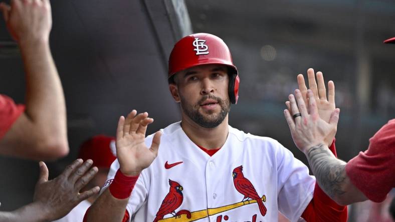 Jul 17, 2023; St. Louis, Missouri, USA;  St. Louis Cardinals center fielder Dylan Carlson (3) is congaratulated by teammates after scoring against the Miami Marlins during the third inning at Busch Stadium. Mandatory Credit: Jeff Curry-USA TODAY Sports