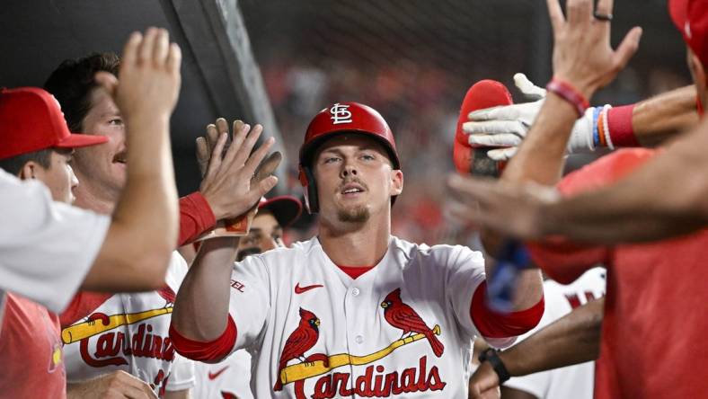 Jul 17, 2023; St. Louis, Missouri, USA;  St. Louis Cardinals pinch hitter Nolan Gorman (16) is congratulated by teammates after scoring against the Miami Marlins during the sixth inning at Busch Stadium. Mandatory Credit: Jeff Curry-USA TODAY Sports