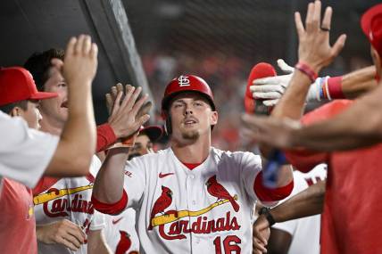 Jul 17, 2023; St. Louis, Missouri, USA;  St. Louis Cardinals pinch hitter Nolan Gorman (16) is congratulated by teammates after scoring against the Miami Marlins during the sixth inning at Busch Stadium. Mandatory Credit: Jeff Curry-USA TODAY Sports