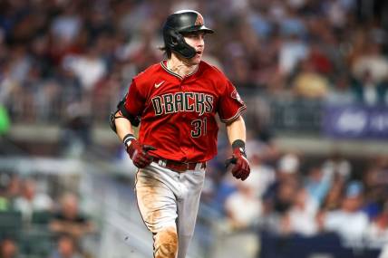 Jul 19, 2023; Atlanta, Georgia, USA; Arizona Diamondbacks right fielder Jake McCarthy (31) hits a single against the Atlanta Braves in the ninth inning at Truist Park. Mandatory Credit: Brett Davis-USA TODAY Sports