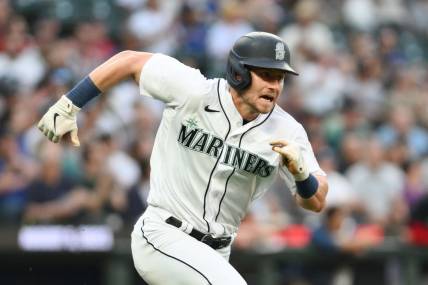 Jul 19, 2023; Seattle, Washington, USA; Seattle Mariners left fielder Jarred Kelenic (10) runs toward first base after hitting a single against the Minnesota Twins during the seventh inning at T-Mobile Park. Mandatory Credit: Steven Bisig-USA TODAY Sports