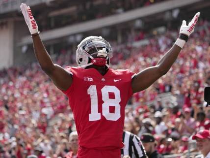September 10, 2022; Columbus, Ohio, USA; Ohio State Buckeyes wide receiver Marvin Harrison Jr. (18) celebrates after scoring a touchdown during the second half of Saturday's game against the Arkansas State Red Wolves at Ohio Stadium.Mandatory Credit: Barbara J. Perenic/Columbus Dispatch