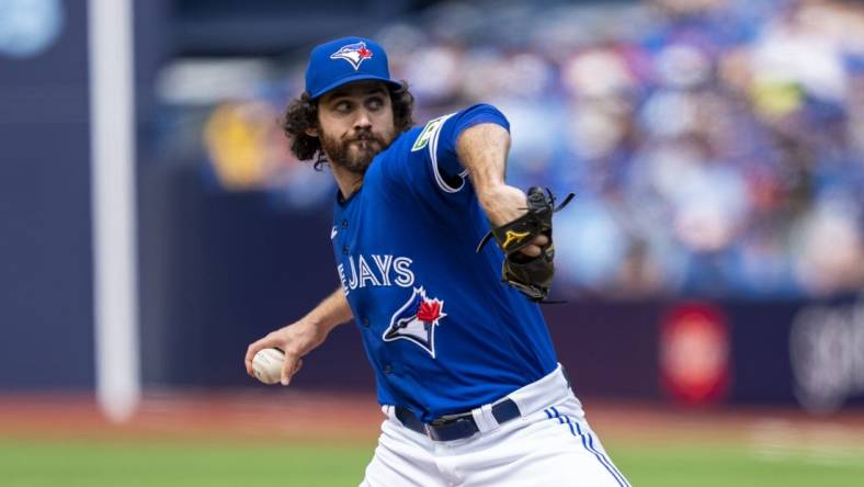 Jul 20, 2023; Toronto, Ontario, CAN; Toronto Blue Jays relief pitcher Jordan Romano (68) pitches to the San Diego Padres during the ninth inning at Rogers Centre. Mandatory Credit: Kevin Sousa-USA TODAY Sports