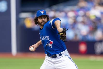 Jul 20, 2023; Toronto, Ontario, CAN; Toronto Blue Jays relief pitcher Jordan Romano (68) pitches to the San Diego Padres during the ninth inning at Rogers Centre. Mandatory Credit: Kevin Sousa-USA TODAY Sports