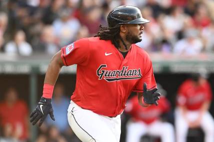 Jul 21, 2023; Cleveland, Ohio, USA; Cleveland Guardians designated hitter Josh Bell (55) hits an RBI double during the first inning against the Philadelphia Phillies at Progressive Field. Mandatory Credit: Ken Blaze-USA TODAY Sports