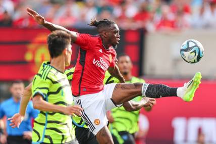 Jul 22, 2023; East Rutherford, New Jersey, USA; Manchester United defender Aaron Wan-Bissaka (29) plays the ball in front of Arsenal midfielder Declan Rose (41) during the first half at MetLife Stadium. Mandatory Credit: Vincent Carchietta-USA TODAY Sports