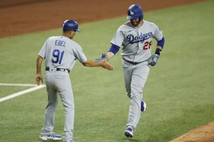 Jul 22, 2023; Arlington, Texas, USA; Los Angeles Dodgers designated hitter J.D. Martinez (28) is congratulated by third base coach Dino Ebel (91) after hitting a three-run home run against the Texas Rangers in the fourth inning at Globe Life Field. Mandatory Credit: Tim Heitman-USA TODAY Sports