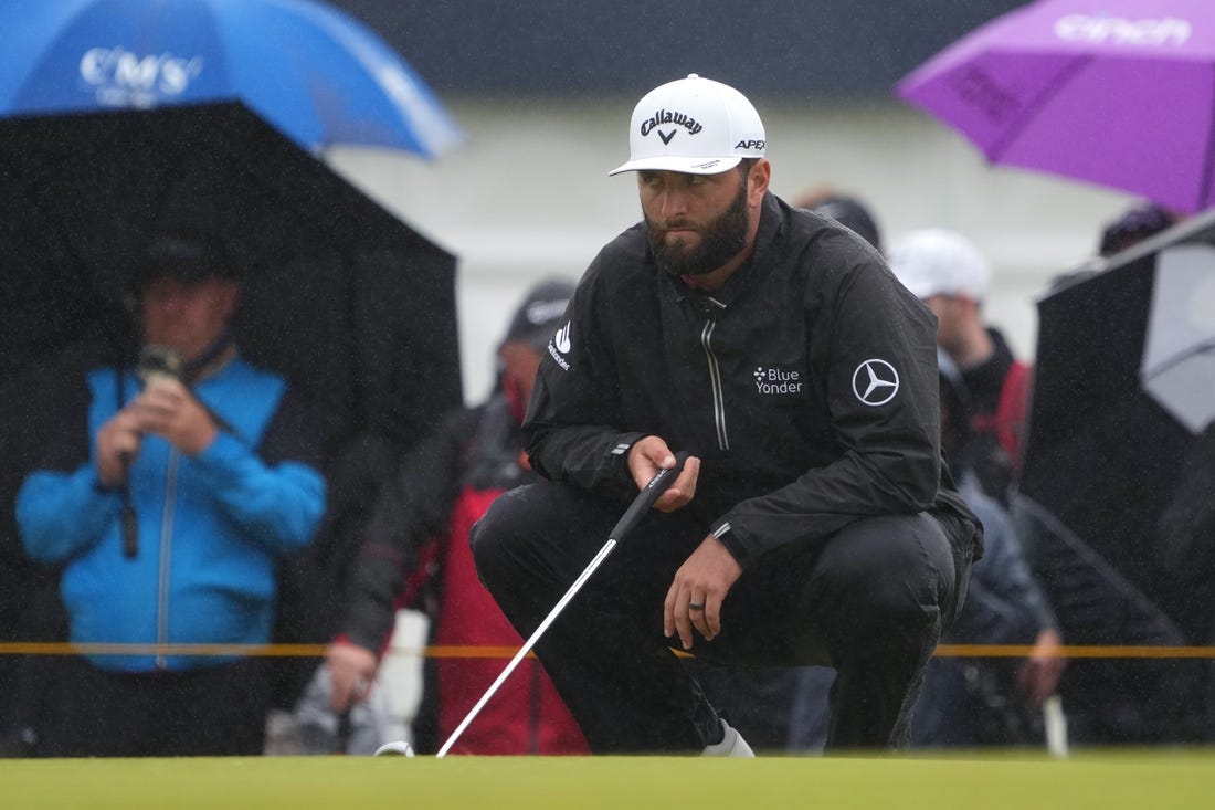 Jul 23, 2023; Hoylake, England, GBR; Jon Rahm lines up a putt on the second green during the final round of The Open Championship golf tournament. Mandatory Credit: Kyle Terada-USA TODAY Sports