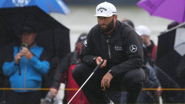 Jul 23, 2023; Hoylake, England, GBR; Jon Rahm lines up a putt on the second green during the final round of The Open Championship golf tournament. Mandatory Credit: Kyle Terada-USA TODAY Sports