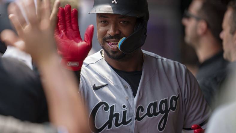 Jul 23, 2023; Minneapolis, Minnesota, USA; Chicago White Sox designated hitter Eloy Jimenez (74) celebrates in the dugout after hitting a home run off Minnesota Twins starting pitcher Bailey Ober (17) in the second inning at Target Field. Mandatory Credit: Matt Blewett-USA TODAY Sports