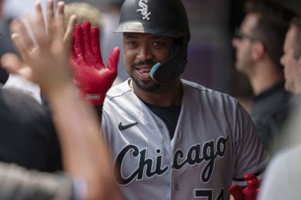 Jul 23, 2023; Minneapolis, Minnesota, USA; Chicago White Sox designated hitter Eloy Jimenez (74) celebrates in the dugout after hitting a home run off Minnesota Twins starting pitcher Bailey Ober (17) in the second inning at Target Field. Mandatory Credit: Matt Blewett-USA TODAY Sports