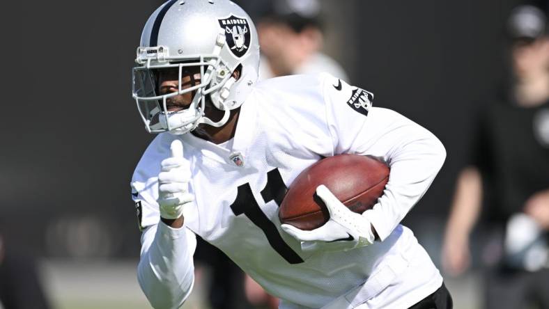 Jul 26, 2023; Las Vegas, Nevada, USA; Las Vegas Raiders wide receiver Phillip Dorsett (11) runs a drill during training camp at the Intermountain Health Performance Center. Mandatory Credit: Candice Ward-USA TODAY Sports