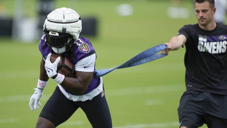 Jul 27, 2023; Owings Mills, MD, USA; Baltimore Ravens running back Melvin Gordon III (33) performs a drill during training camp practice at Under Armour Performance Center. Mandatory Credit: Brent Skeen-USA TODAY Sports