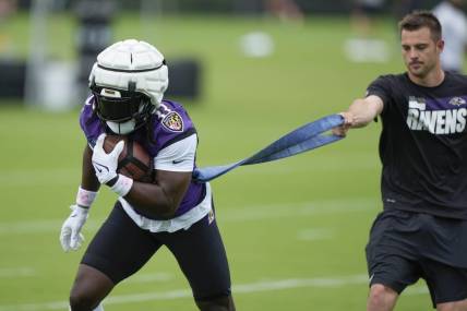 Jul 27, 2023; Owings Mills, MD, USA; Baltimore Ravens running back Melvin Gordon III (33) performs a drill during training camp practice at Under Armour Performance Center. Mandatory Credit: Brent Skeen-USA TODAY Sports