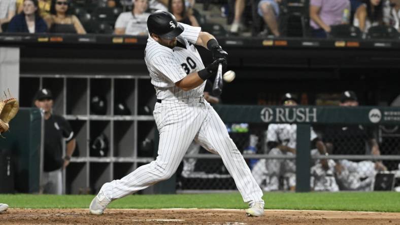 Jul 27, 2023; Chicago, Illinois, USA; Chicago White Sox third baseman Jake Burger (30) hits a two-run home run against the Cleveland Guardians during the fifth inning at Guaranteed Rate Field. Mandatory Credit: Matt Marton-USA TODAY Sports