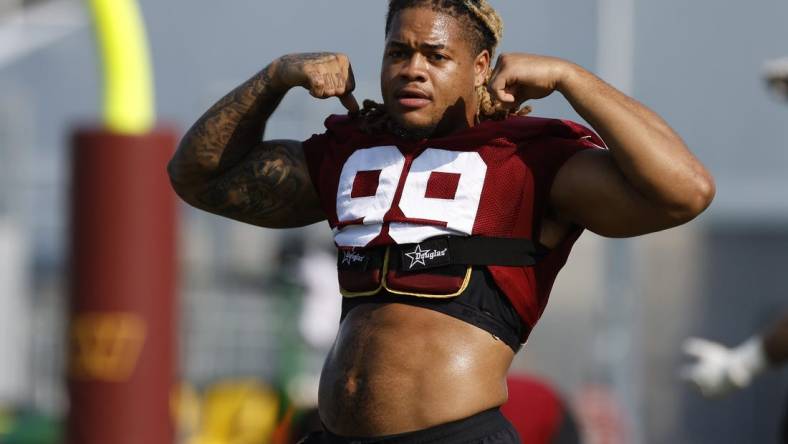 Jul 28, 2023; Ashburn, VA, USA; Washington Commanders defensive end Chase Young (99) gestures on day three of Commanders training camp at OrthoVirginia Training Center. Mandatory Credit: Geoff Burke-USA TODAY Sports