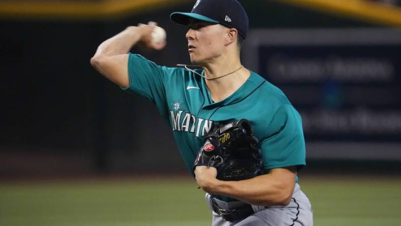 Jul 29, 2023; Phoenix, Arizona, USA; Seattle Mariners starting pitcher Bryan Woo (33) pitches against the Arizona Diamondbacks during the first inning at Chase Field. Mandatory Credit: Joe Camporeale-USA TODAY Sports