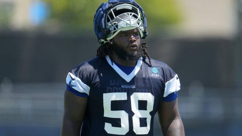 Jul 29, 2023; Oxnard, CA, USA; Dallas Cowboys defensive tackle Mazi Smith (58) wears a Guardian helmet cap during training camp at the River Ridge Fields. Mandatory Credit: Kirby Lee-USA TODAY Sports