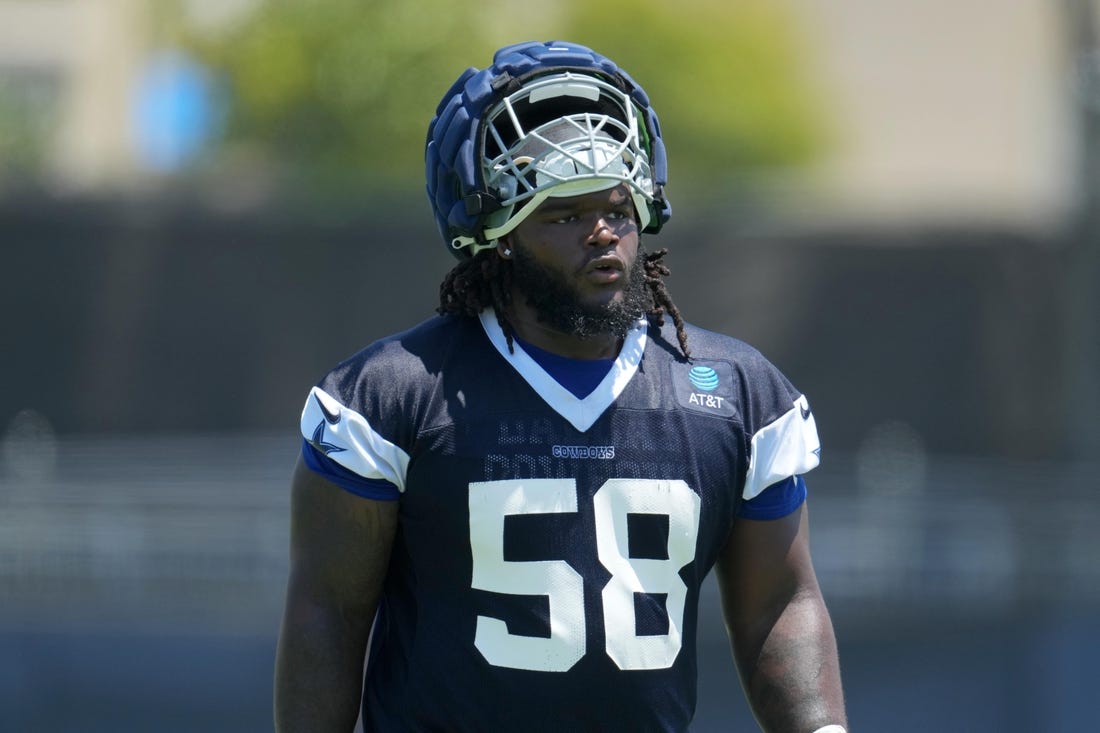 Jul 29, 2023; Oxnard, CA, USA; Dallas Cowboys defensive tackle Mazi Smith (58) wears a Guardian helmet cap during training camp at the River Ridge Fields. Mandatory Credit: Kirby Lee-USA TODAY Sports