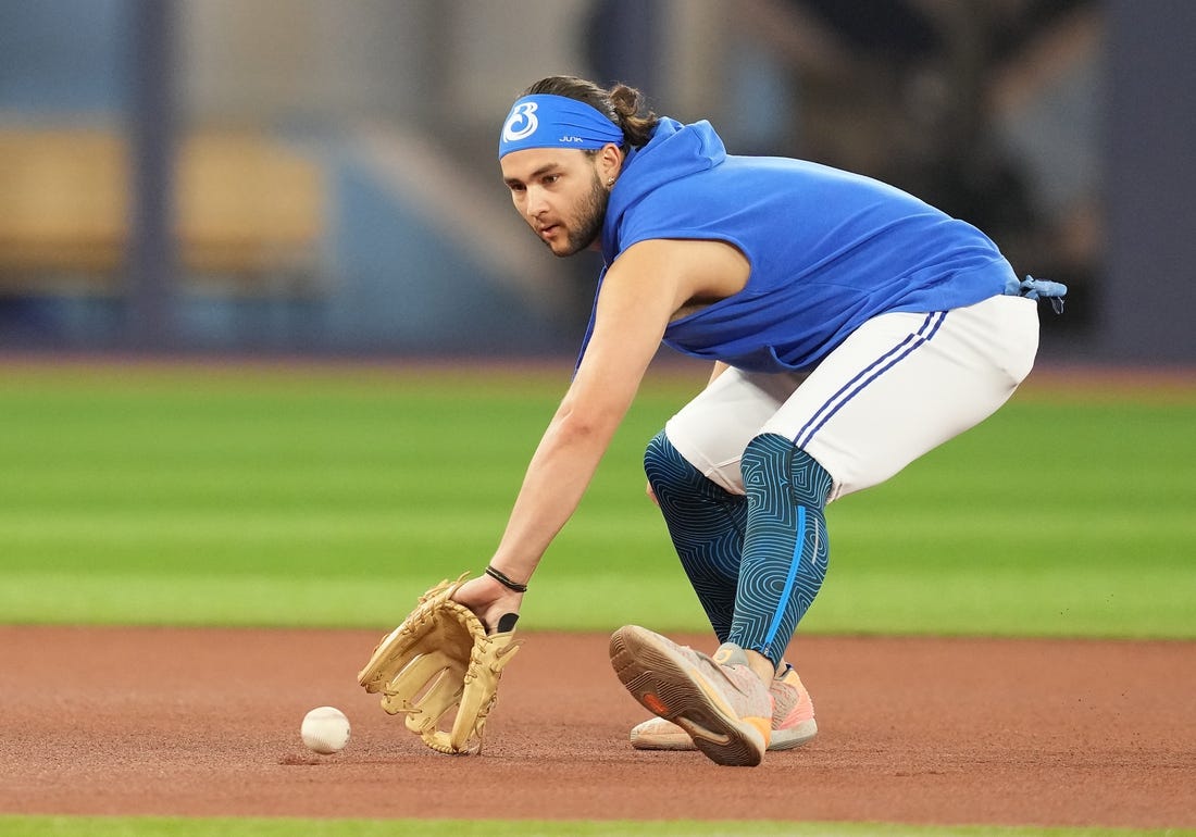 Jul 31, 2023; Toronto, Ontario, CAN; Toronto Blue Jays shortstop Bo Bichette (11) fields balls during batting practice before a game against the Baltimore Orioles at Rogers Centre. Mandatory Credit: Nick Turchiaro-USA TODAY Sports