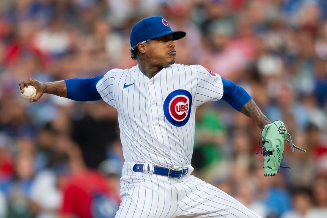 Jul 31, 2023; Chicago, Illinois, USA; Chicago Cubs starting pitcher Marcus Stroman (0) pitches during the first inning against the Cincinnati Reds at Wrigley Field. Mandatory Credit: Patrick Gorski-USA TODAY Sports